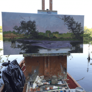 Plein air canvas painting of a river