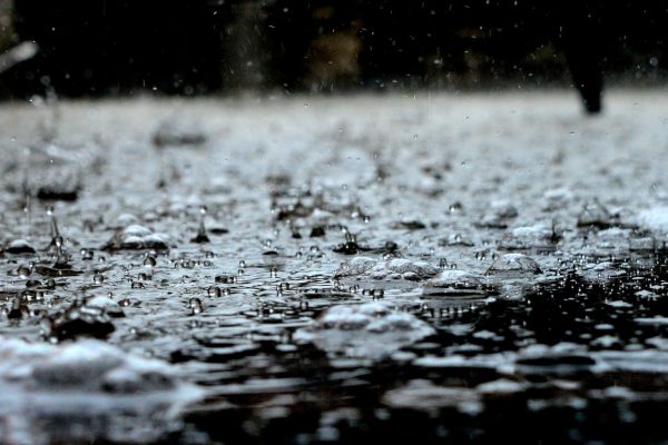 Rain splattering on water